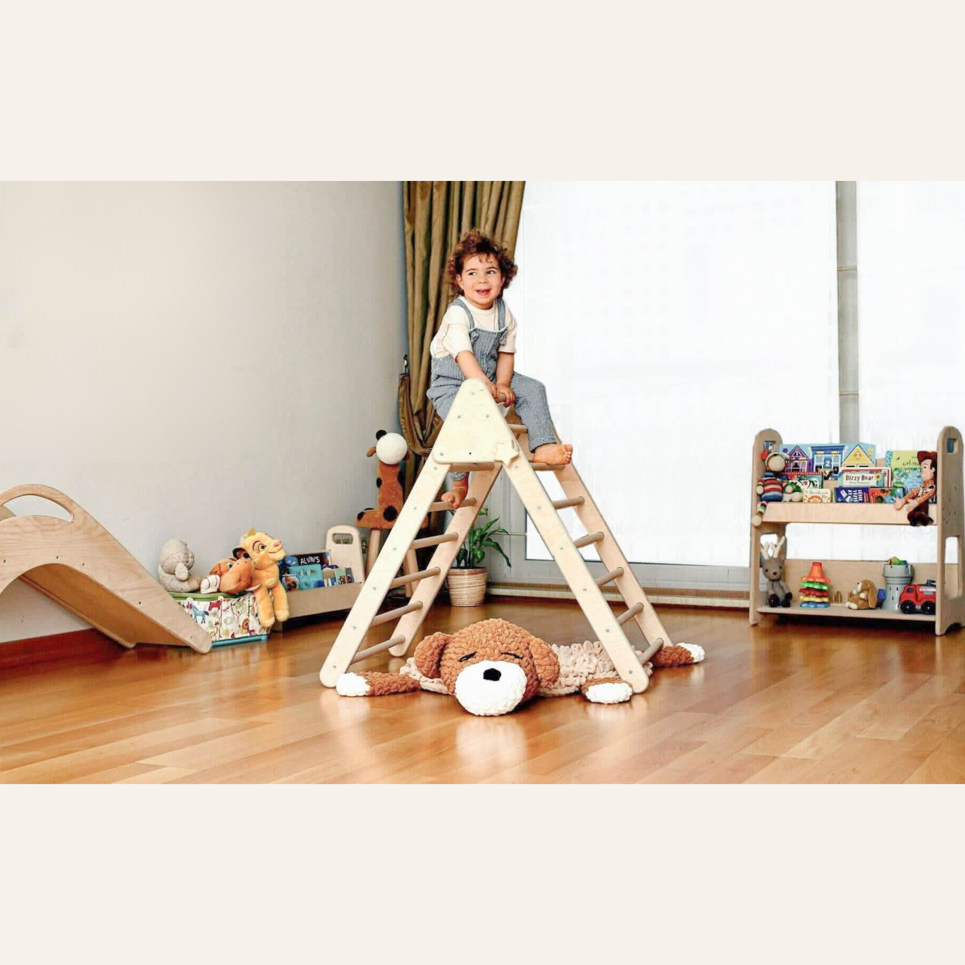 toddler using pikler triangle climbing toy at home