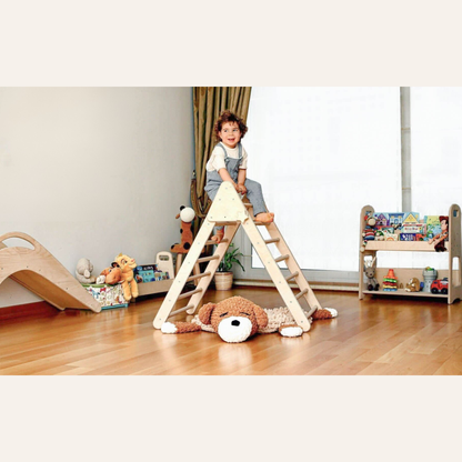 toddler using pikler triangle climbing toy at home