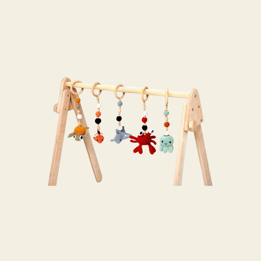 wooden baby play gym with hanging toys for sensory play