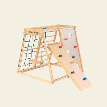 toddler using indoor wooden rock climber set